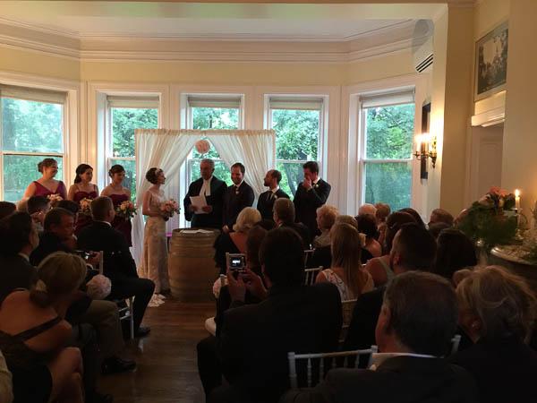 Ceremony in an intimate room.